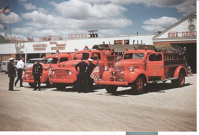 Picture of original firehouse with original equipment truck and two original pumpers